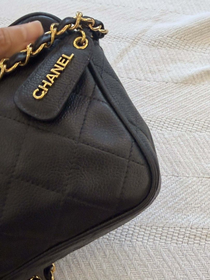 Original Vintage Chanel Camera Bag (Category: Luxury Bags & Wallets) located in San Juan City. Submitted by exclusivelyours (Listing ID 1435325277, Image 2). Description: This is a highly sought-after piece from the mid-90s, specifically crafted in Black Caviar Leather with 24k Gold-Plated Hardware. (Verified by LegitGrails with certificate included) While Chanel still makes camera bags, this specific boxy, structured vintage shape with the large