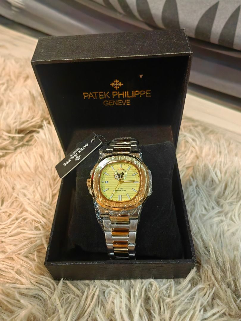 Patek Philippe Geneve Watch (Category: Luxury Watches) located in Cebu City. Submitted by esrpreloved (Listing ID 1435218483, Image 1). Description: - Patek Philippe watch - Features a gold and silver-toned band - Elegant gold-colored face - Includes original black box with Patek Philippe Geneve logo - Date display function - Original tag still attached - A stylish and sophisticated accessory.