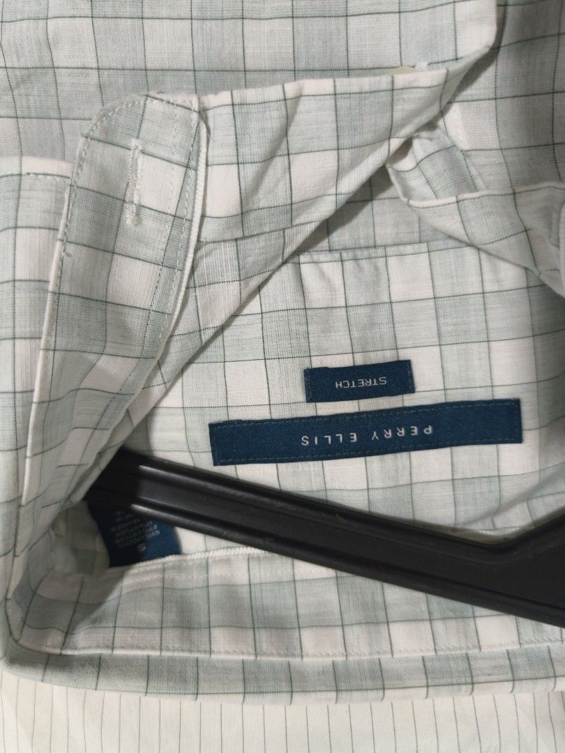 Perry Ellis Short Sleeve Checkered Shirt (Category: Tshirts & Polo Shirts ) located in Davao. Submitted by igor_rogi (Listing ID 1435205418, Image 2). Description: - Perry Ellis short-sleeved shirt - Checkered pattern - Button-down front - Collared neckline - Lightweight stretch fabric - Perfect for warm weather - Versatile style.