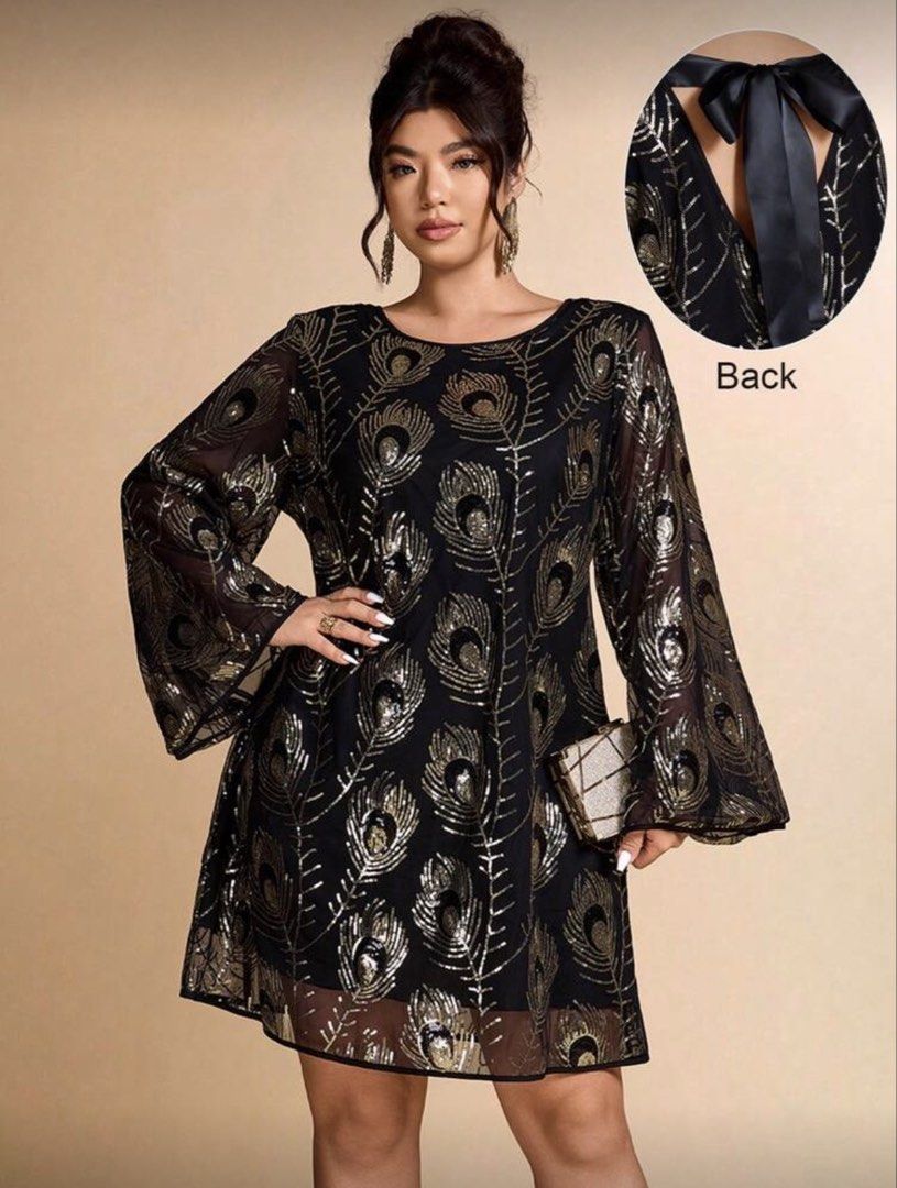 Plus size dress (Category: Dresses) located in San Pedro. Submitted by percabel (Listing ID 1435265835, Image 1). Description: - Used once for event - Originally purchased for 1,200 - Elegant black dress with a beautiful gold peacock feather print. - Features long bell sleeves and a flattering A-line silhouette. - Includes a keyhole back with a stylish satin tie. - Available in size 18 (3XL). - Measurements: - Shoulder: 18.5 in - Bust: 51.6 in - 