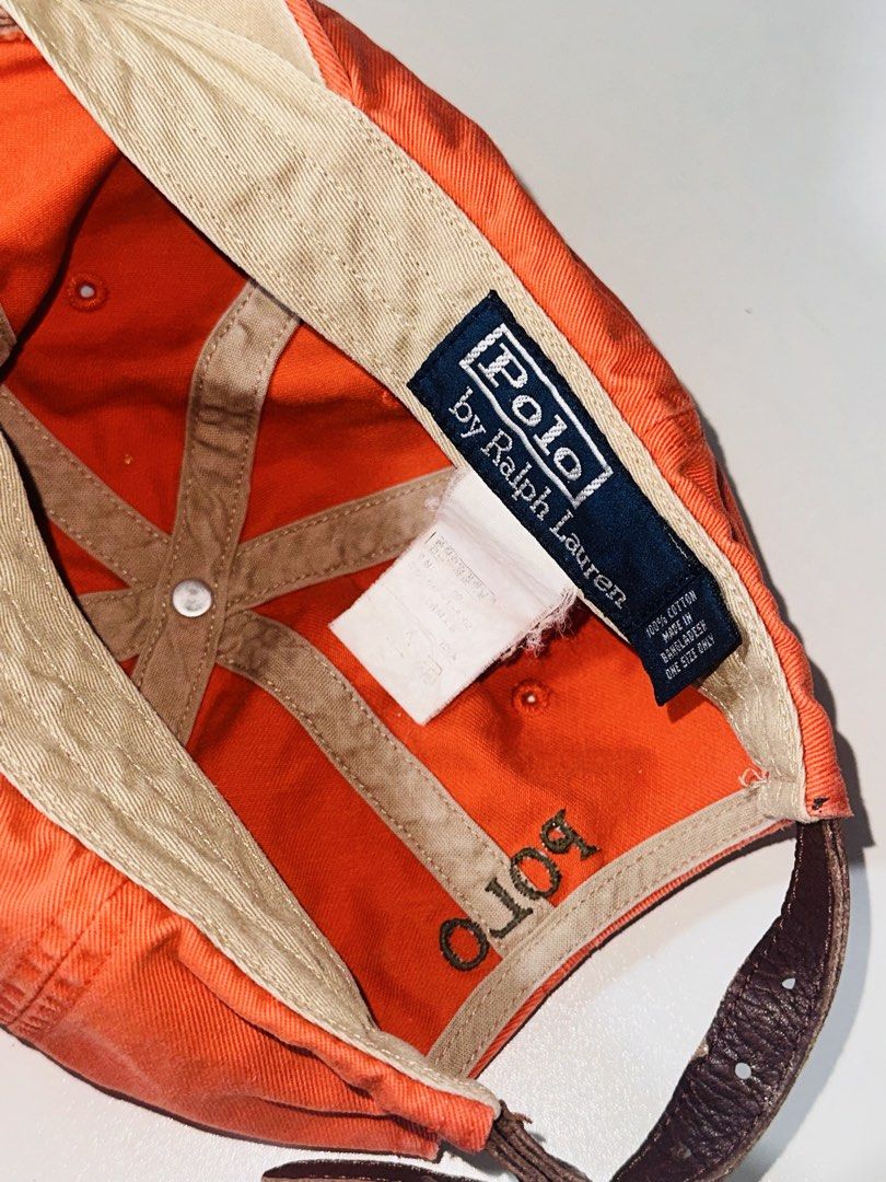 Polo Ralph Lauren Leatherstrap Ball Cap Orange Dadhat (Category: Caps & Hats) located in Santa Barbara. Submitted by marcaws (Listing ID 1432943618, Image 3). Description: - Authentic Polo Ralph Lauren cap - Color: Orange 🍊 colorway / Dark Green Pony - Color rate: 9/10 - Vintage Leatherstrap back - Size: Adult size -Condition: Excellent - No issues.