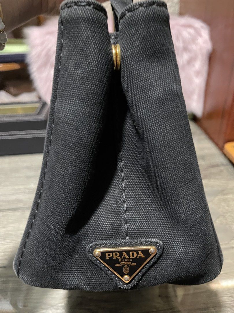 Prada Canvas Tote Bag ( Canapa ) (Category: Luxury Bags & Wallets) located in Cavite. Submitted by beamitch (Listing ID 1435255682, Image 2). Description: - Authentic Prada canapa bag - Detachable striped shoulder strap - Prada logo on front and side - Gold-toned hardware - Protective feet on the bottom - Top handles for carrying - with strap only 💯% original mode of shipping: lbc only or lalamove to be book by the buyer .