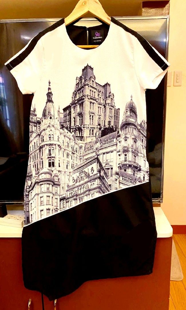 Printed Dress with Black and White Design (Category: Dresses) located in Manila. Submitted by prettypink4 (Listing ID 1435197059, Image 1). Description: - Unique black and white design - Cityscape print on top - Solid black bottom - Short sleeves with black stripes - Round neckline - Lightweight fabric - Back zipper closure - Suitable for various occasions.