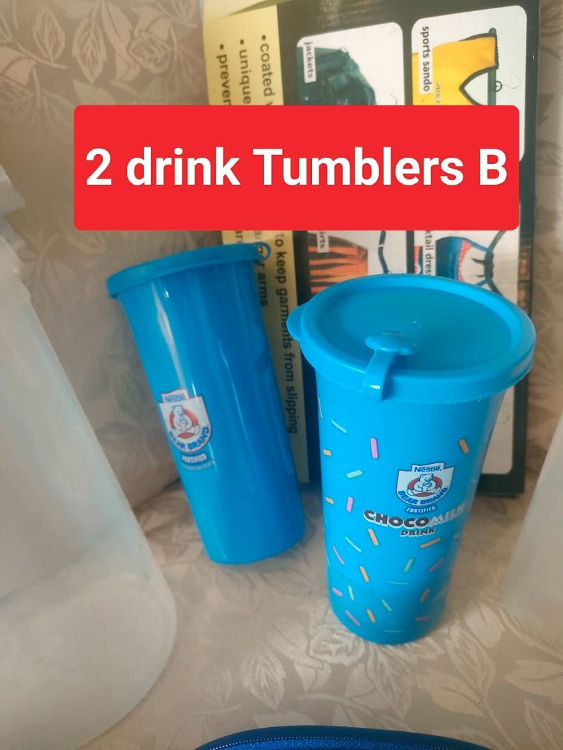 Set B: Food Storage, Tumblers, Hanger, Pitcher (Category: Other Kitchenware & Tableware) located in Caloocan City. Submitted by rise-edge (Listing ID 1435204039, Image 3). Description: - Food storage container - 2 Nestle Choco Milk tumblers - Flexi Hanger - Water pitcher - Pair of blue Spoon and Fork cases - Spider-Man lunchbox (Well Used) - Mobile Screen Enlarger - Eye Glasses Cases Selling all items for PHP500.00!.