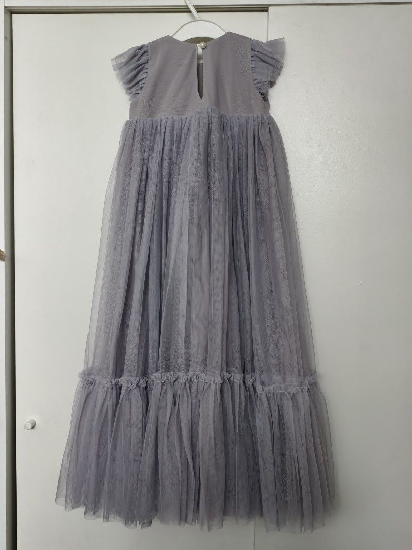 Spinkiewear Grey Tulle Dress (Category: Babies & Kids Fashion) located in Calamba. Submitted by junethomasb (Listing ID 1435219338, Image 2). Description: - Spinkiewear grey tulle dress - Size: 2/3 - Features: Round neckline, short flutter sleeves, floral embellishment - Design: Floor-length skirt with ruffled hem - Ideal for special occasions.