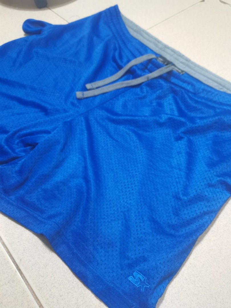 Starter Mesh Shorts - Blue (Category: Shorts) located in Quezon City. Submitted by elihur.tuazon (Listing ID 1435332097, Image 2). Description: - Starter mesh shorts - Color: Blue - Size: L (36-38) - Features: Drawstring waist, gray waistband, Starter logo - Material: 100% polyester - Made in Bangladesh - Ideal for sports and casual wear.
