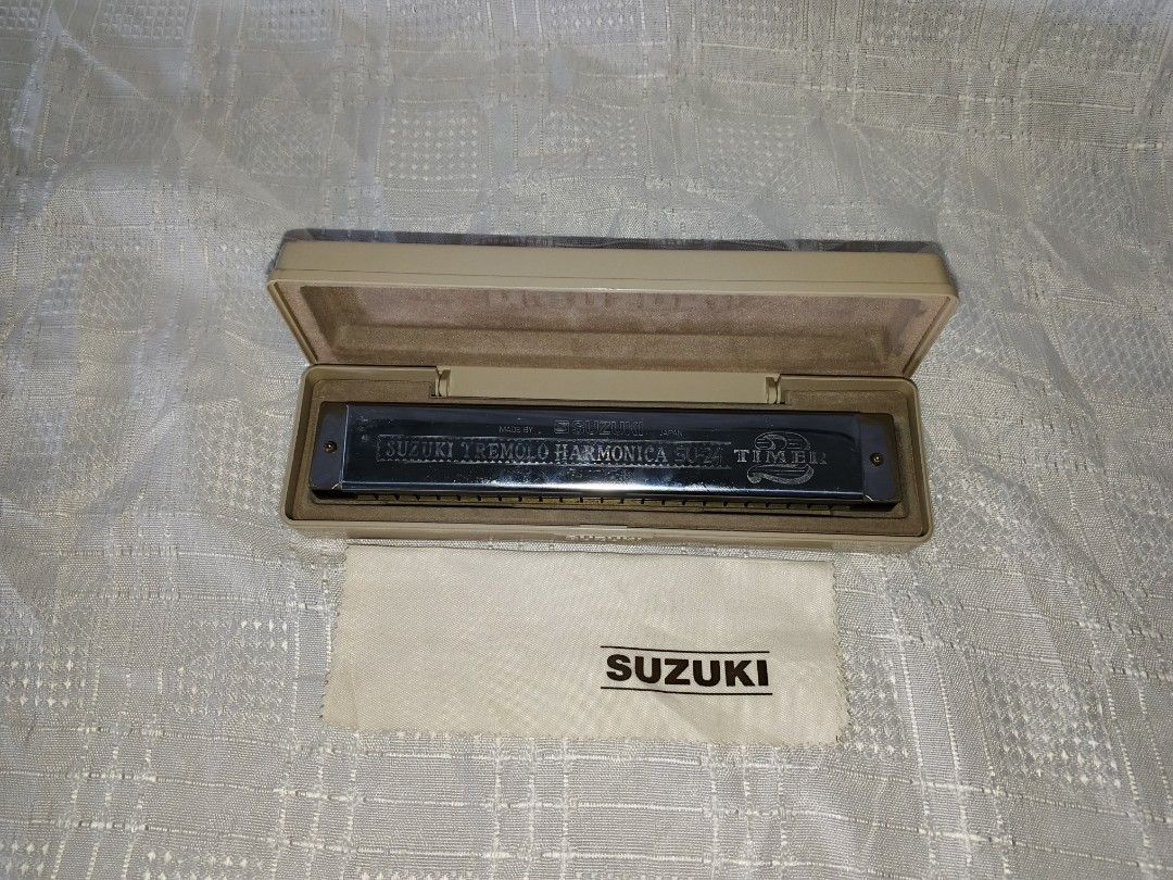 Suzuki Tremolo Harmonica SU-24 (Category: Musical Instruments) located in Baguio. Submitted by iyakoy (Listing ID 1435277434, Image 2). Description: - Suzuki SU-24 Tremolo Harmonica - Key of C - Includes original case and cleaning cloth - Silver harmonica - Beige case - 24-hole tremolo - Made in Japan.