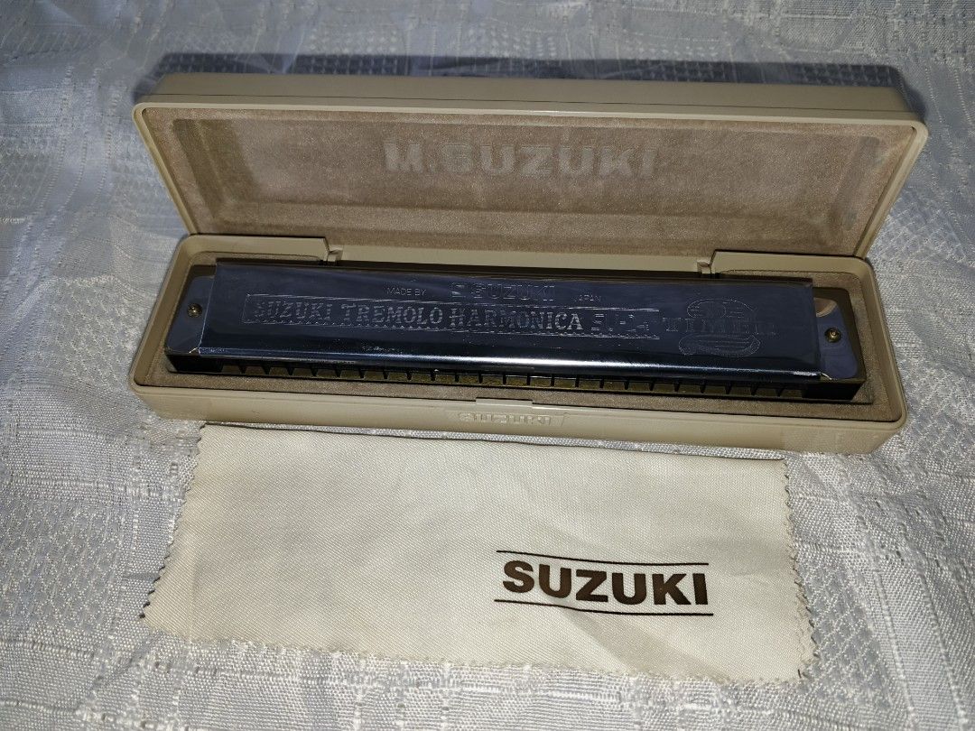 Suzuki Tremolo Harmonica SU-24 (Category: Musical Instruments) located in Baguio. Submitted by iyakoy (Listing ID 1435277434, Image 3). Description: - Suzuki SU-24 Tremolo Harmonica - Key of C - Includes original case and cleaning cloth - Silver harmonica - Beige case - 24-hole tremolo - Made in Japan.