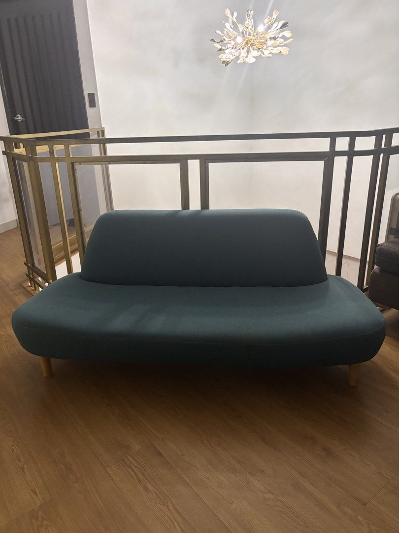Teal Curved Sofa (Category: Sofas) located in Muntinlupa City. Submitted by ldb.nino (Listing ID 1435196790, Image 1). Description: - Stylish teal curved sofa - Modern design with rounded back and seat - Features wooden legs - Adds elegance to any living space 3-4 seater Has minimal stain Needs cleaning.