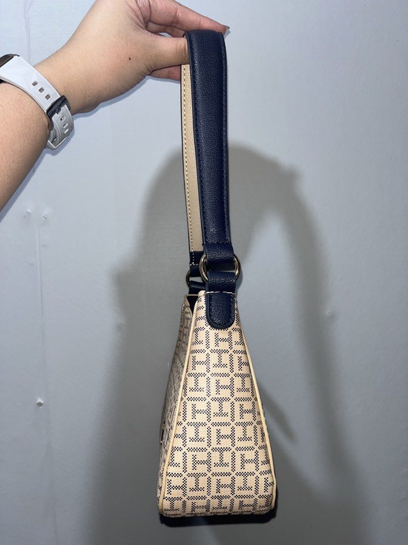 Tommy Hilfiger Shoulder Bag (micro kili bag) (Category: Shoulder Bags) located in Manila. Submitted by papapeyy (Listing ID 1409497651, Image 3). Description: - Authentic Tommy Hilfiger shoulder bag - New with original tags (price: $98) - Stylish beige and navy pattern - Features a top handle - Secure zipper closure - Beautiful floral interior lining.