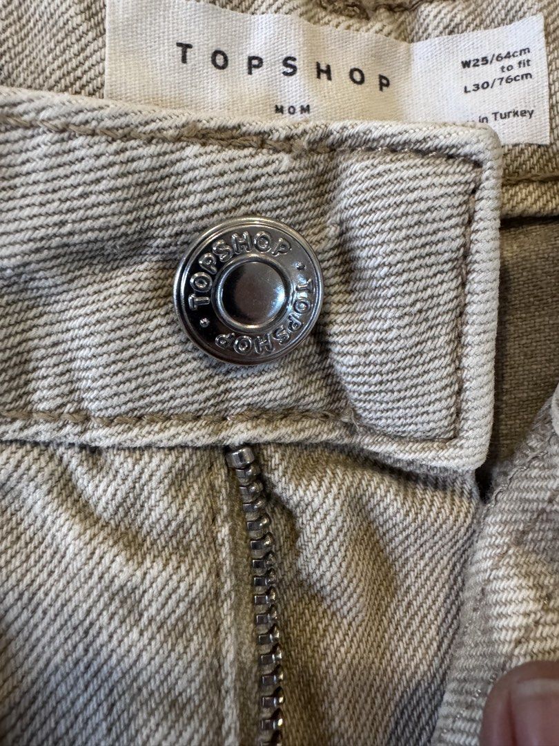 Topshop Mom Jeans - W25 (Category: Jeans) located in Manila. Submitted by mr_1990 (Listing ID 1435249532, Image 3). Description: Used once Topshop Mom jeans - Neutral color - Size: W25/64cm, L30/76cm - Made in Turkey - Button and zipper closure - Classic five-pocket design - Perfect for everyday wear.