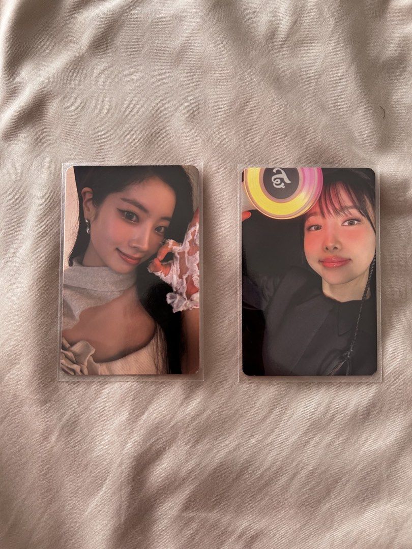 TWICE Photocards (Category: K-Wave Merchandise) located in Quezon City. Submitted by christianramirez (Listing ID 1435181934, Image 1). Description: Collection of TWICE photocards featuring various members. Includes cards with members Dahyun, Nayeon, Jeongyeon, Momo, Mina, Chaeyoung, Sana, and more. Some cards feature the members with lightsticks and Oishi snacks. All cards are in protective sleeves. 200 pesos each..