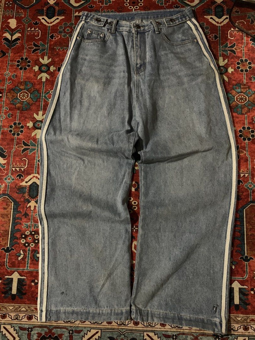 Vault Vintage Wide Leg Jeans (Category: Jeans) located in Cagayan de Oro. Submitted by chabermz (Listing ID 1435189980, Image 1). Description: - Vault Vintage wide-leg jeans - Light blue wash - White stripes on sides - Relaxed fit - Button and zipper closure - Two front and two back pockets - Vault Vintage label visible - Need wash Dimes W- 32 T- 14.5 L- 42 H- 11.