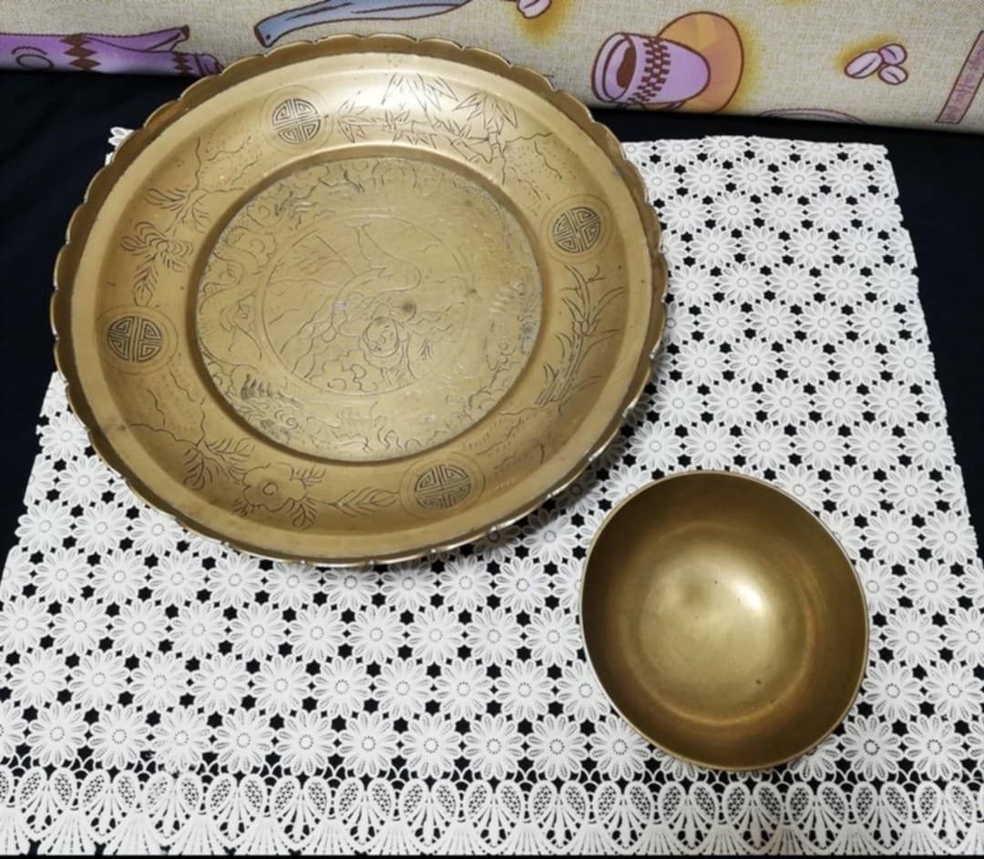Vintage Brass Plate and Bowl Set (Category: Dinnerware & Cutlery) located in Cainta. Submitted by marynette39 (Listing ID 1435310112, Image 1). Description: - Vintage brass plate and bowl set - Plate features: - Intricate engraved design - Scalloped edge - Bowl is a smaller, rounded brass piece - Perfect for display or collection - Small Bowl - Dia-4.5 inches Depth-2 inches -Plate- Dia- 11 inches .