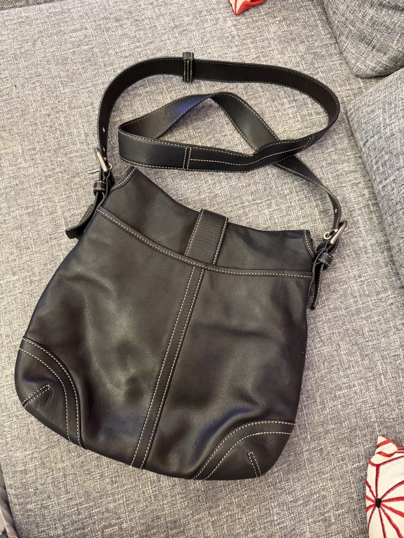 Vintage Coach Soho Buckle Flap Bag (Category: Luxury Bags & Wallets) located in San Jose. Submitted by affordabletrendsby_cai (Listing ID 1435178132, Image 3). Description: - Black leather Coach shoulder bag - Flap closure with silver buckle - Adjustable long strap - Coach logo patterned interior - White stitching details - Includes Coach tag - Model number: A05S-9480.