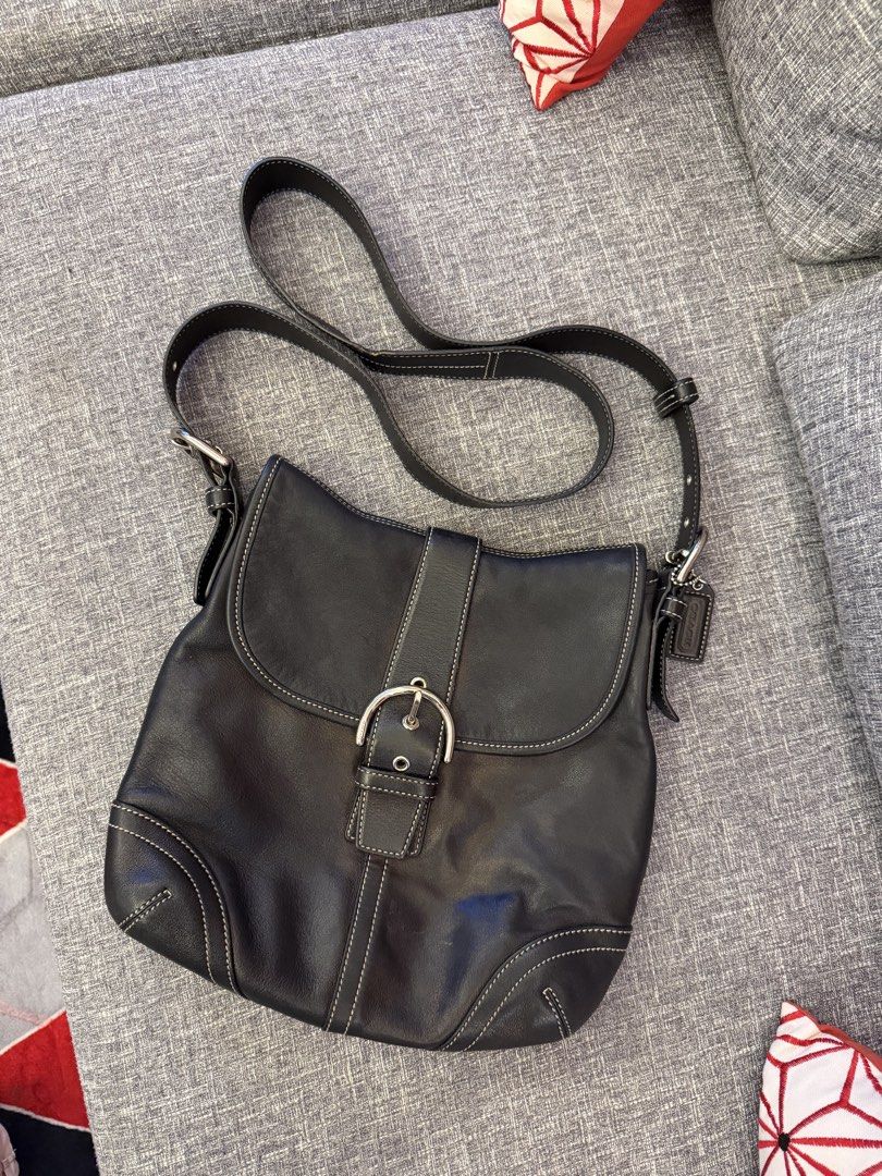 Vintage Coach Soho Buckle Flap Bag (Category: Luxury Bags & Wallets) located in San Jose. Submitted by affordabletrendsby_cai (Listing ID 1435178132, Image 1). Description: - Black leather Coach shoulder bag - Flap closure with silver buckle - Adjustable long strap - Coach logo patterned interior - White stitching details - Includes Coach tag - Model number: A05S-9480.