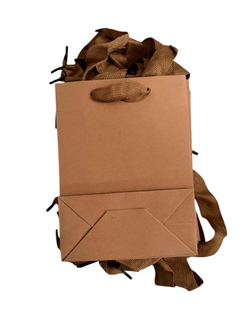 10pcs Brown Craft Paper Gift Bag with Handle (Category: Tote Bags) located in Manila. Submitted by athanjuno (Listing ID 1430140469, Image 2). Description: - 10 pcs Brown gift bag - Sturdy construction - Stylish ribbon handle - Ideal for small gifts and party favors - Simple, elegant design - Suitable for various occasions Msg for more details. STRICTLY - No cancellation - No return/No exchange/No refund Payment Options: - BP| / GCash.
