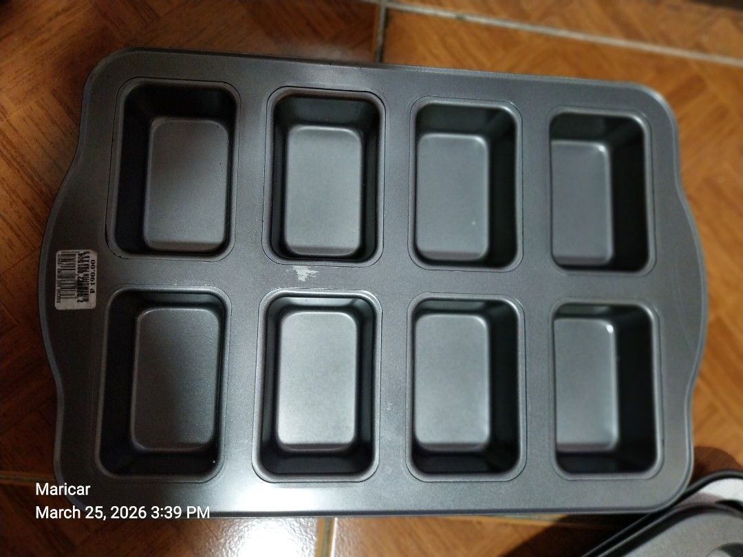 8-Cavity Mini Loaf Pan (Category: Bakeware) located in Pasig City. Submitted by rare.ashima25 (Listing ID 1430103521, Image 1). Description: 8-cavity mini loaf pan. It is made of metal and has a rectangular shape. The pan is designed for baking small loaves of bread or cakes. It has a non-stick surface for easy release and cleaning. Perfect for making individual portions..