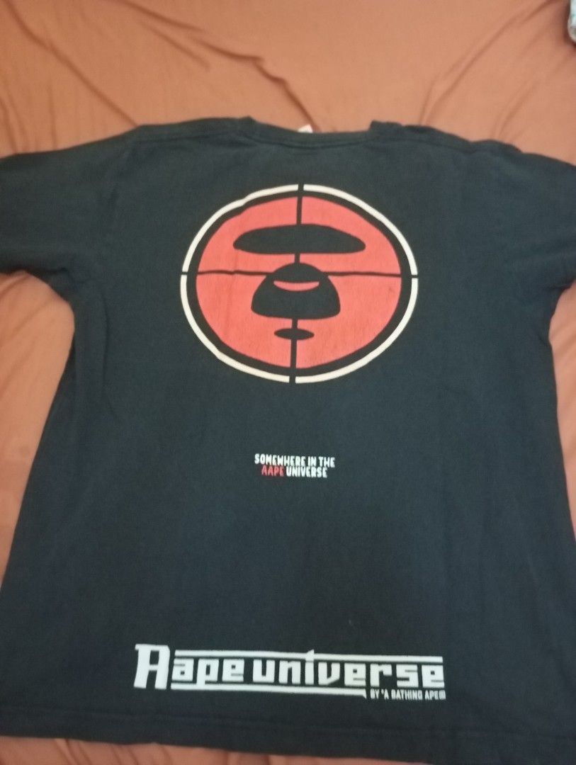 AAPE by A Bathing Ape Black T-shirt (Category: Tshirts & Polo Shirts ) located in Manila. Submitted by kimlee_ (Listing ID 1430207478, Image 2). Description: - AAPE by A Bathing Ape T-shirt - Size: L - Features: - AAPE logo on the front - Target-like graphic with Ape Head logo on the back - "SOMEWHERE IN THE AAPE UNIVERSE" printed on the back.