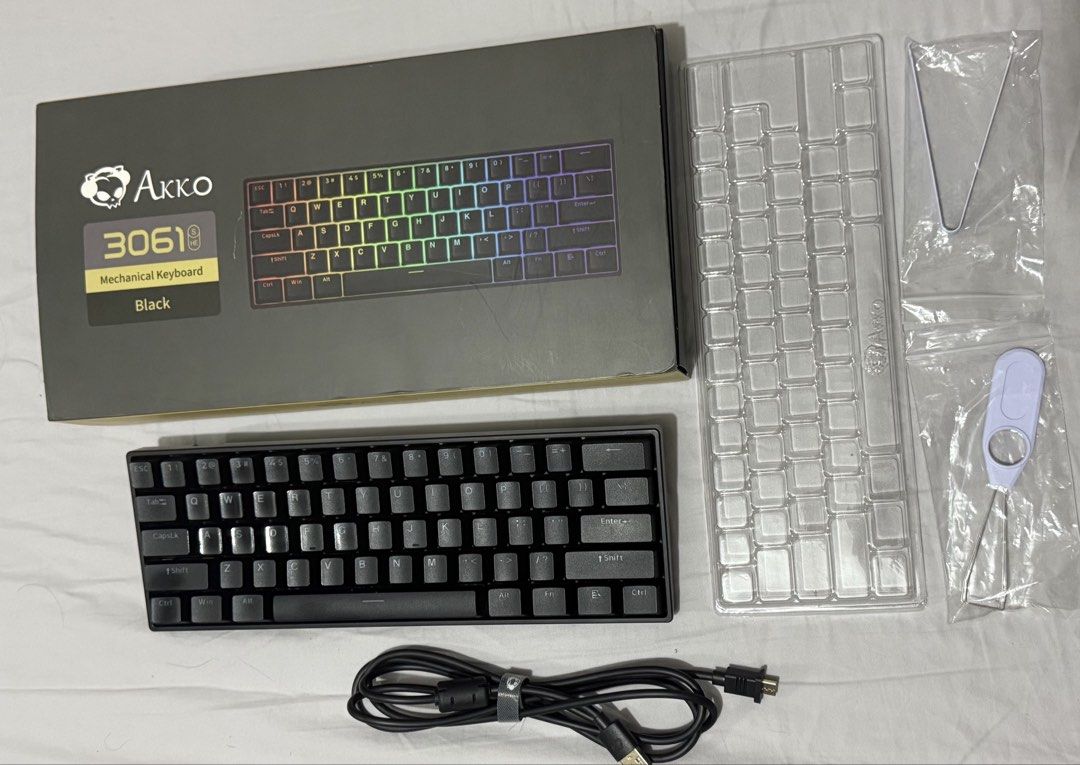 Akko 3061 Mechanical Keyboard Black (Category: Computer Keyboard) located in Pasig City. Submitted by joyleslielim (Listing ID 1430209045, Image 1). Description: Akko 3061 Black mechanical keyboard with Kailh Sakura Pink Magnetic switches. Includes the original box, keycap puller, and USB-C cable. The keyboard has a 60% layout. Bought from Datablitz July 19, 2025 Original price is 5,295 Used for 5months only. With RGB backlighting.