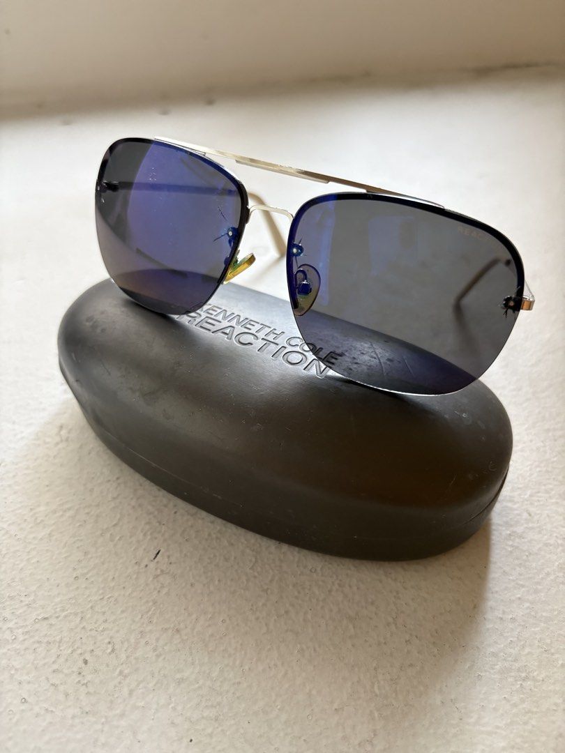 Authentic Kenneth Cole Rimless Sunglasses / Shades (Category: Luxury Accessories) located in Mandaluyong City. Submitted by material_boi (Listing ID 1430073067, Image 1). Description: Store bought for I think ₱7K years ago. Super lightweight! Literally you don’t feel like you’re wearing anything. Metal frame. Rimless. Glass lenses (not plastic). It Perfect for the summer! Issues: signs of use and age. Yung lense nya where the screws are attached 