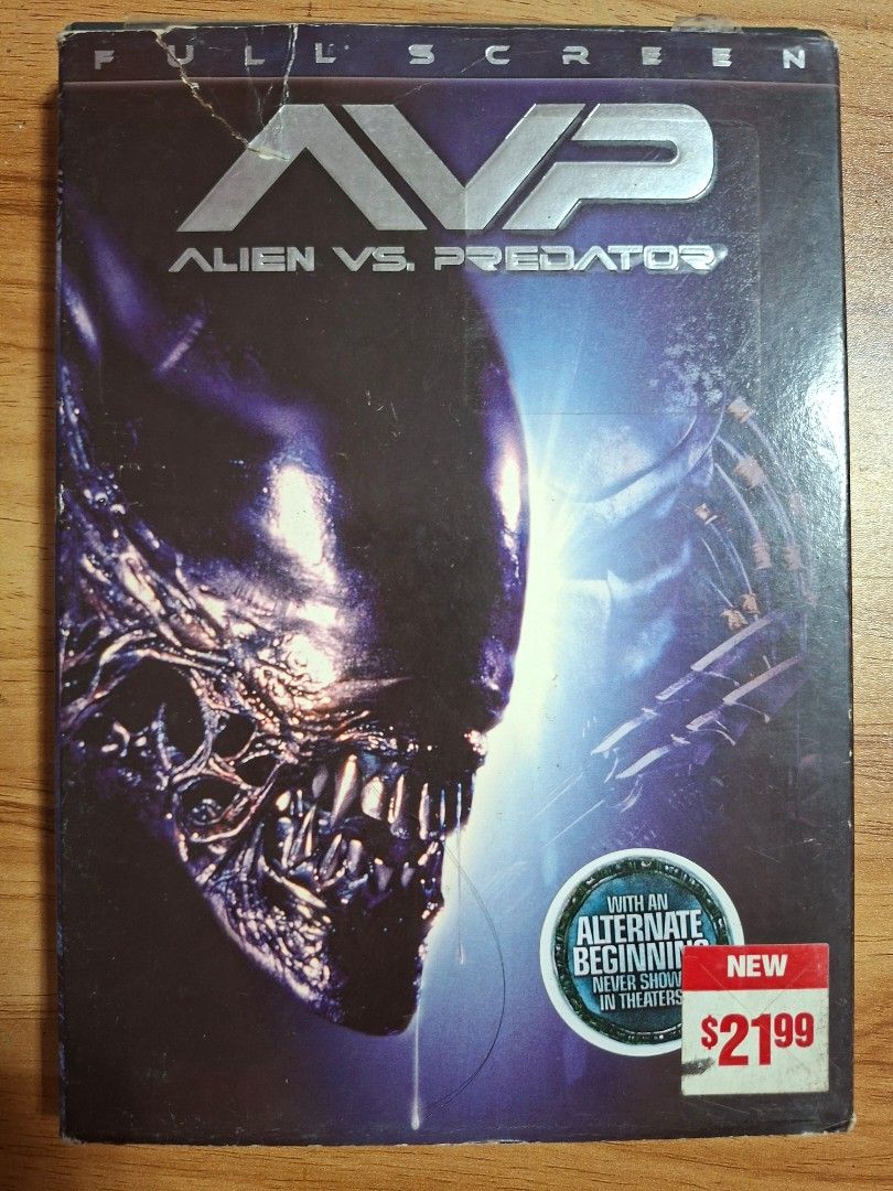 AVP: Alien vs. Predator DVD (Category: CDs & DVDs) located in Kabankalan. Submitted by Videoshop.ph (Listing ID 1430147866, Image 1). Description: DVD of the movie AVP: Alien vs. Predator. It includes special features such as a director's cut, audio commentary, and behind-the-scenes content. The DVD is full screen and includes an alternate beginning. The original price tag shows $21.99. The DVD case has some wear and tear..