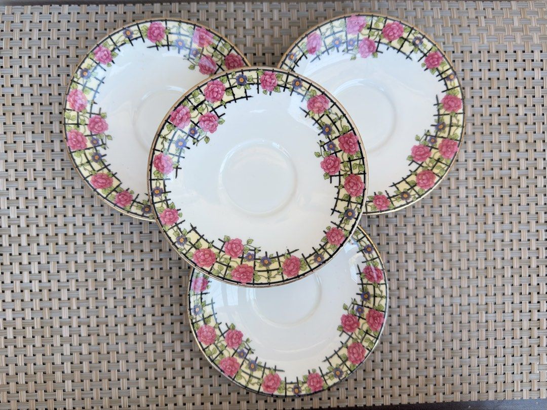 Aynsley England Saucers (Category: Coffee & Tea Tableware) located in Bulacan. Submitted by fancy.surplusera (Listing ID 1430078314, Image 1). Description: Set of four Aynsley England saucers. Features a floral design with pink roses and a gold rim. The saucers have a white base with a decorative border. The Aynsley England mark is visible on the underside of one saucer. A classic and elegant addition to any tea set. Condition: 7/10 Size: 14cm Pr