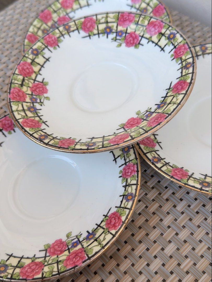 Aynsley England Saucers (Category: Coffee & Tea Tableware) located in Bulacan. Submitted by fancy.surplusera (Listing ID 1430078314, Image 3). Description: Set of four Aynsley England saucers. Features a floral design with pink roses and a gold rim. The saucers have a white base with a decorative border. The Aynsley England mark is visible on the underside of one saucer. A classic and elegant addition to any tea set. Condition: 7/10 Size: 14cm Pr