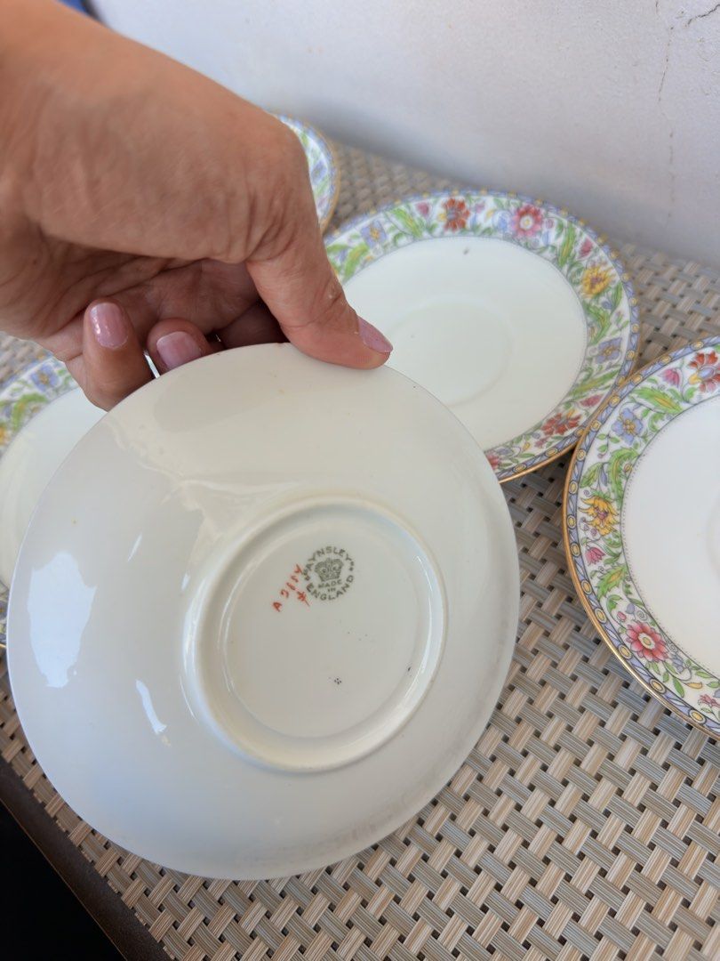 Aynsley Royal Winton Saucers (Category: Coffee & Tea Tableware) located in Bulacan. Submitted by fancy.surplusera (Listing ID 1430078096, Image 3). Description: Set of five Royal Winton saucers. Features a floral design with gold trim. The back of one saucer shows the Royal Winton England mark. Perfect for adding a touch of vintage elegance to your tea set. Condition: 8/10 Size: 14cm Price sold as set.