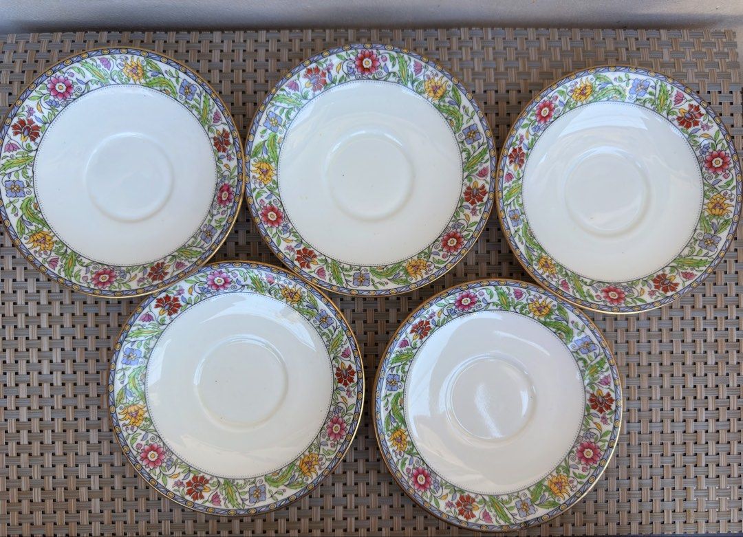 Aynsley Royal Winton Saucers (Category: Coffee & Tea Tableware) located in Bulacan. Submitted by fancy.surplusera (Listing ID 1430078096, Image 1). Description: Set of five Royal Winton saucers. Features a floral design with gold trim. The back of one saucer shows the Royal Winton England mark. Perfect for adding a touch of vintage elegance to your tea set. Condition: 8/10 Size: 14cm Price sold as set.