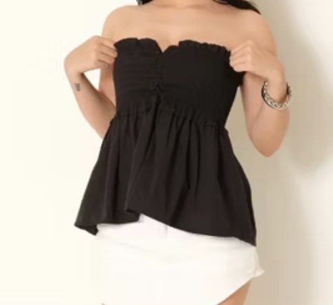 Black Strapless Peplum Top (Category: Sleeveless) located in Bacolod City. Submitted by girlydecluttering (Listing ID 1430173402, Image 1). Description: Elegant black with straps top with a sweetheart neckline and peplum design. Features a ruched bodice and a flared, asymmetrical hemline. Perfect for a night out or a special occasion. The top has a flattering silhouette and is made of a lightweight fabric..