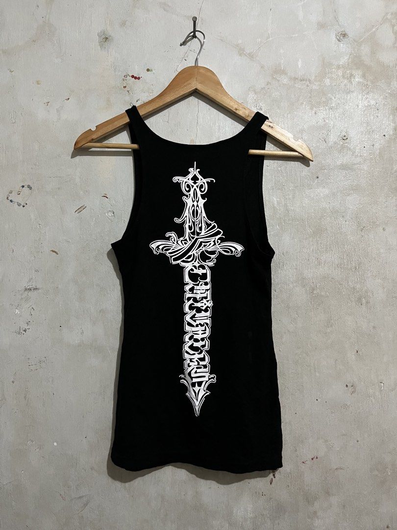 Black Tank Top with Graphic Print (Category: Sleeveless) located in Santa Cruz. Submitted by thriftgane0.2 (Listing ID 1430103782, Image 1). Description: Black tank top with a unique graphic print on the back. Features a sword design with intricate detailing and text. The front has a simple design on the bottom left. Sleeveless design, perfect for casual wear. Made from a comfortable fabric..