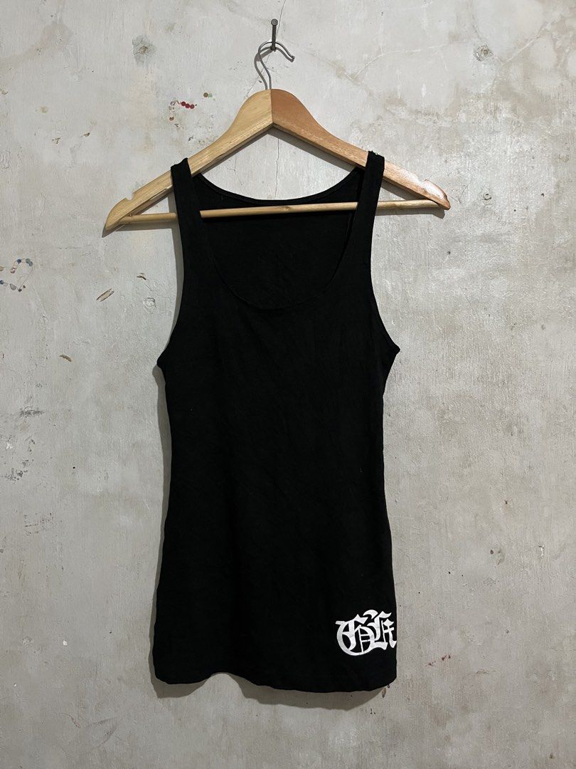 Black Tank Top with Graphic Print (Category: Sleeveless) located in Santa Cruz. Submitted by thriftgane0.2 (Listing ID 1430103782, Image 2). Description: Black tank top with a unique graphic print on the back. Features a sword design with intricate detailing and text. The front has a simple design on the bottom left. Sleeveless design, perfect for casual wear. Made from a comfortable fabric..