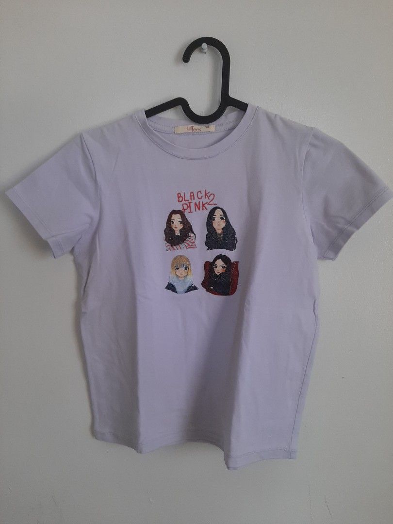 Blackpink Graphic T-shirt (Category: Babies & Kids Fashion) located in Las Pinas. Submitted by cj_e06 (Listing ID 1430073126, Image 1). Description: light purple t-shirt featuring a Blackpink graphic on the front. The graphic includes images of the band members and the words "BLACKPINK". The shirt has short sleeves and a round neckline. size 12.