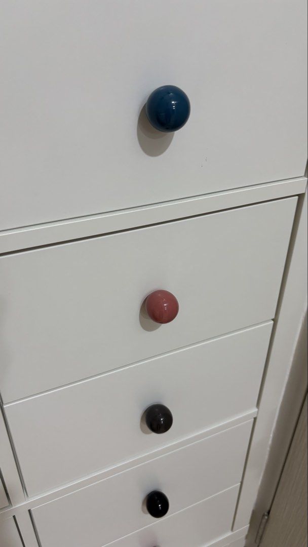 Ceramic Drawer Knobs - Assorted Colors (Category: Shelves, Cabinets & Racks) located in Singapore. Submitted by pixlr (Listing ID 1430174269, Image 3). Description: Set of hi-gloss spherical ceramic drawer knobs in various colors. Includes screws for easy installation. Perfect for updating your furniture with a pop of color. Colors include pink, 2 red, 2 black, blue, green, grey, 2 white, and brown. Great for drawers and cabinets..