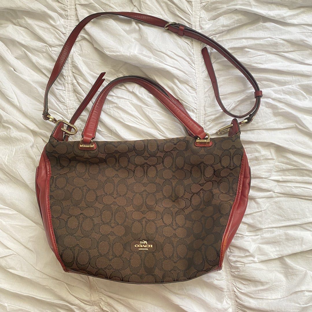 Coach Brown Red Signature Handbag (Category: Luxury Bags & Wallets) located in Quezon City. Submitted by isapoca (Listing ID 1430081687, Image 1). Description: - Authentic Coach handbag - Brown and red signature design - Detachable strap for multiple ways to wear - Spacious interior - Gold Hardware in pristine condition MOP GCash Loc Quezon City.