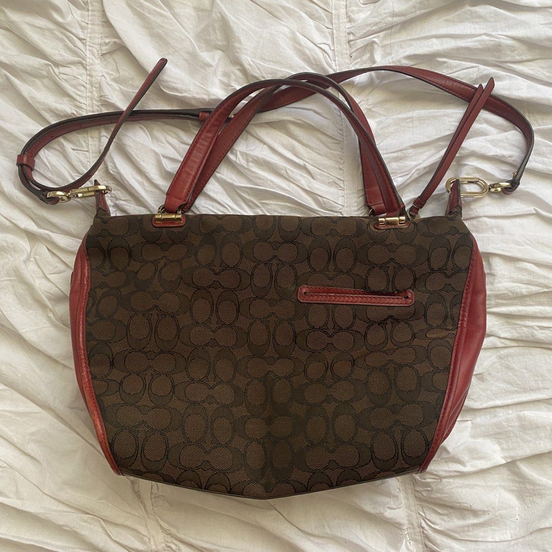 Coach Brown Red Signature Handbag (Category: Luxury Bags & Wallets) located in Quezon City. Submitted by isapoca (Listing ID 1430081687, Image 3). Description: - Authentic Coach handbag - Brown and red signature design - Detachable strap for multiple ways to wear - Spacious interior - Gold Hardware in pristine condition MOP GCash Loc Quezon City.