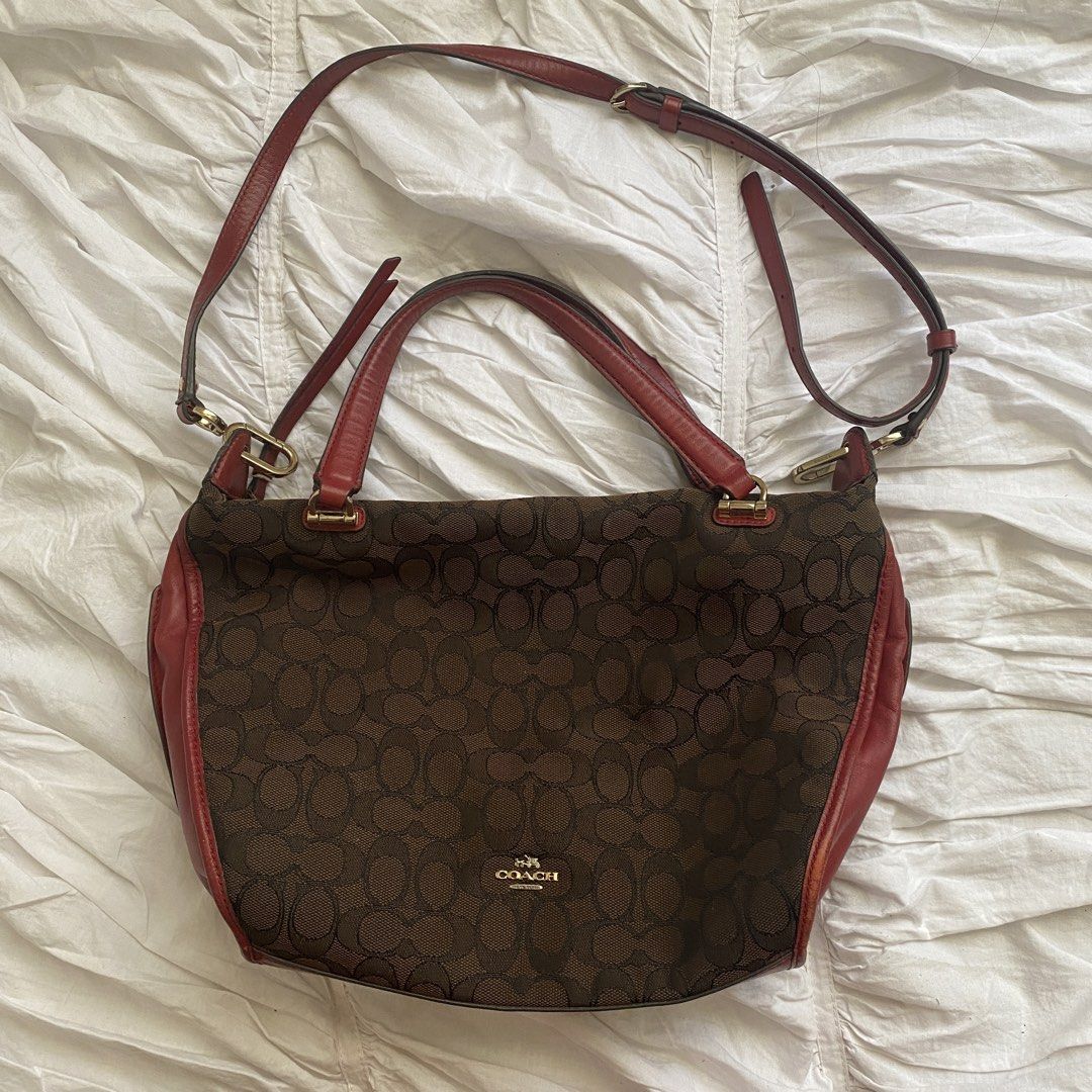 Coach Brown Red Signature Handbag (Category: Luxury Bags & Wallets) located in Quezon City. Submitted by isapoca (Listing ID 1430081687, Image 2). Description: - Authentic Coach handbag - Brown and red signature design - Detachable strap for multiple ways to wear - Spacious interior - Gold Hardware in pristine condition MOP GCash Loc Quezon City.