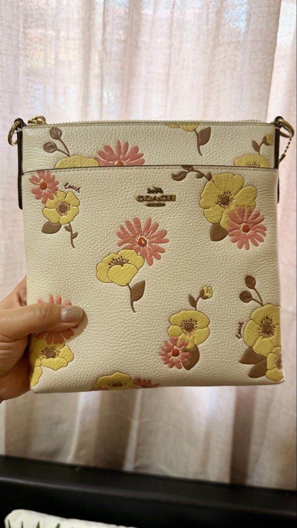 Coach Mini File Bag (Category: Cross-body Bags) located in Manila. Submitted by authenticprelovedmnls (Listing ID 1430067799, Image 2). Description: Flower embossed design. Mini file bag. Signs of usage on corners, please see photos.guaranteed original.