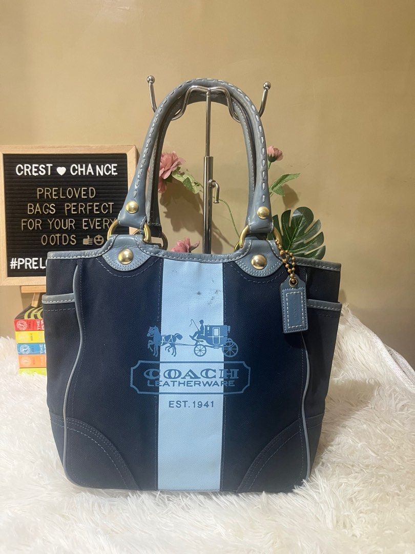 Coach Tote Bag (Category: Luxury Bags & Wallets) located in Mati. Submitted by CrestChancebyIFT (Listing ID 1430128019, Image 1). Description: 10.5 x 15 x 4inches Coach Denim and leather combo Preloved With rubs on edges Body is still good Free twilly for the handles Last price posted🎈.