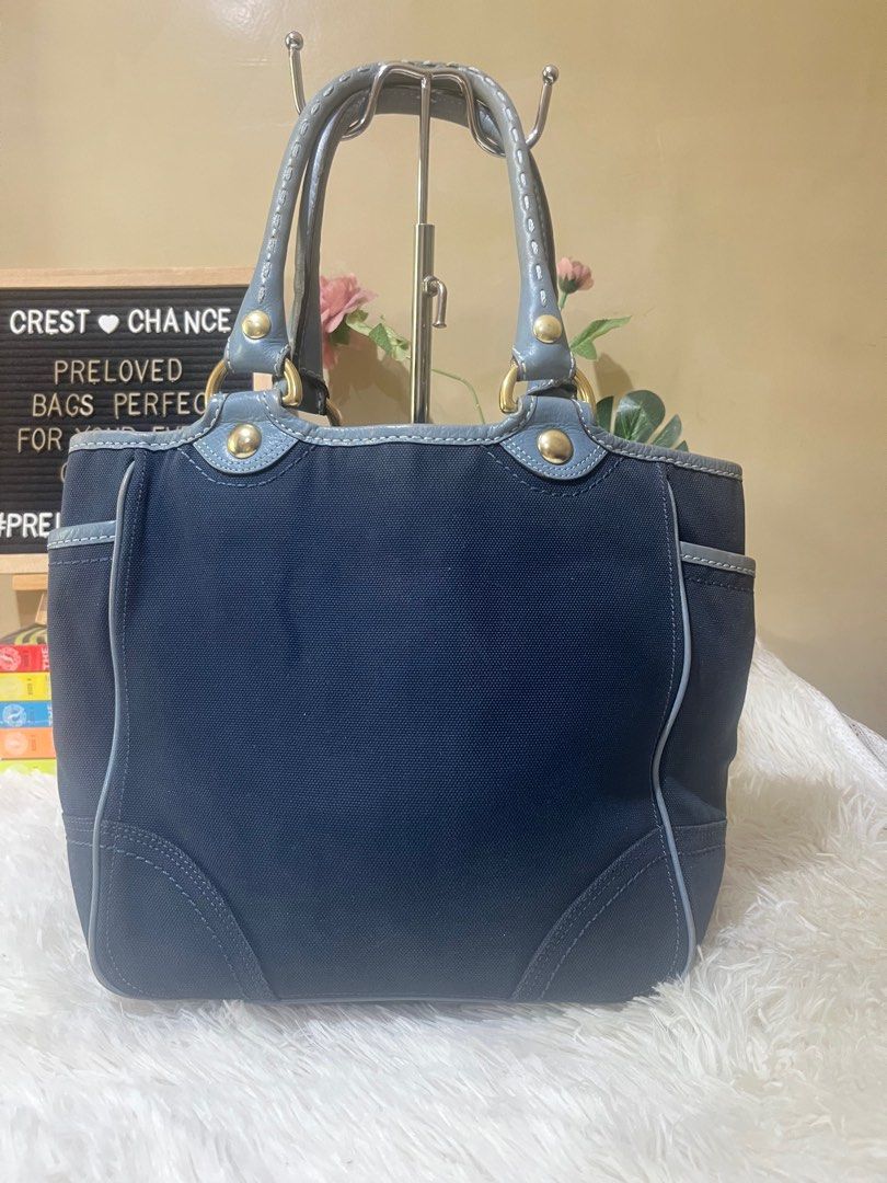 Coach Tote Bag (Category: Luxury Bags & Wallets) located in Mati. Submitted by CrestChancebyIFT (Listing ID 1430128019, Image 2). Description: 10.5 x 15 x 4inches Coach Denim and leather combo Preloved With rubs on edges Body is still good Free twilly for the handles Last price posted🎈.