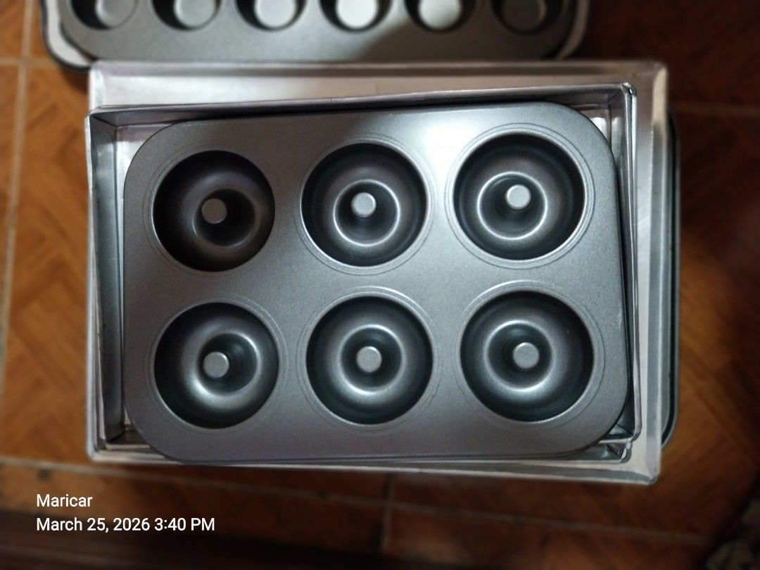 Donut Baking Pan 6's (Category: Bakeware) located in Pasig City. Submitted by rare.ashima25 (Listing ID 1430102895, Image 1). Description: Donut baking pan. It has six molds for making donuts. The pan is made of metal and has a non-stick surface. It is perfect for baking delicious homemade donuts..