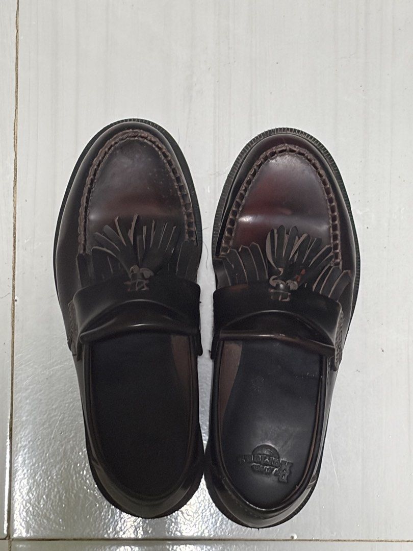Dr. Martens Adrian Tassel Loafers Cherry Red (Category: Loafers) located in Taguig. Submitted by kaiaworld (Listing ID 1430156529, Image 3). Description: Classic Dr. Martens Adrian Tassel Loafers in a deep burgundy color. Features a tassel detail and the iconic Dr. Martens sole. The stitching and sole still intact. A stylish and durable choice for everyday wear. Size 7 3 times worn Old due to storage see pic.