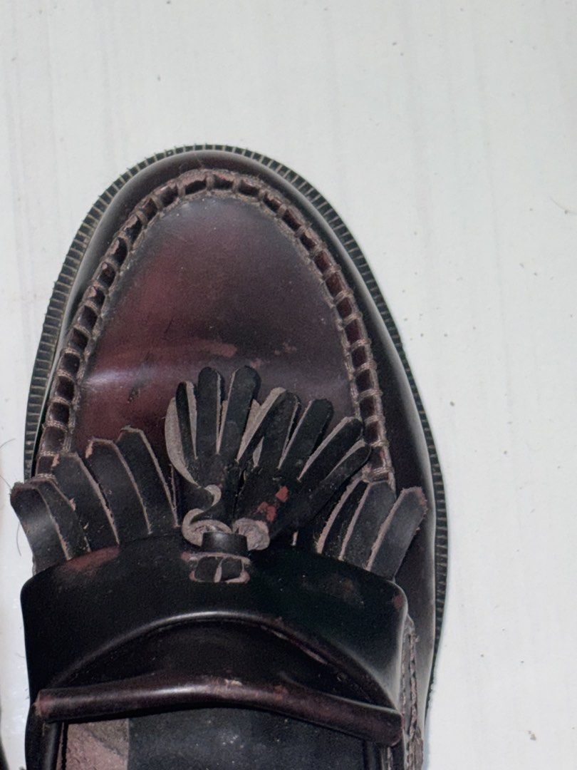 Dr. Martens Adrian Tassel Loafers Cherry Red (Category: Loafers) located in Taguig. Submitted by kaiaworld (Listing ID 1430156529, Image 1). Description: Classic Dr. Martens Adrian Tassel Loafers in a deep burgundy color. Features a tassel detail and the iconic Dr. Martens sole. The stitching and sole still intact. A stylish and durable choice for everyday wear. Size 7 3 times worn Old due to storage see pic.