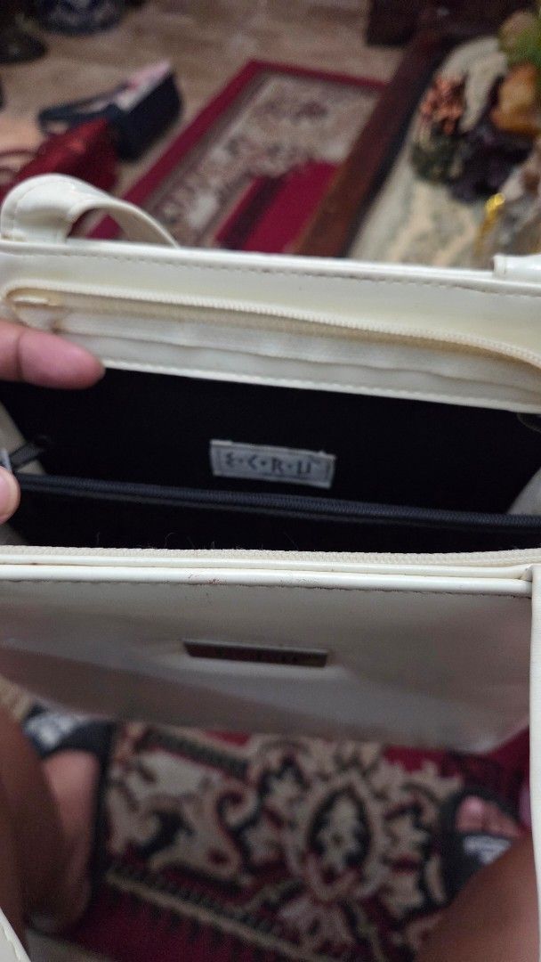 ECRU White Handbag For Sale (Category: Luxury Bags & Wallets) located in Paranaque City. Submitted by nics_11 (Listing ID 1430133573, Image 2). Description: Hi everyone! Selling here my Mom's White handbag with a rectangular shape. Features a small metal plate with the brand name "ECRU". Includes a handle for carrying. The bag has a glossy finish. rfs: Decluttering bags for sale Feel free to pm to inquire and thank you for checking my ad! 🤗💙.
