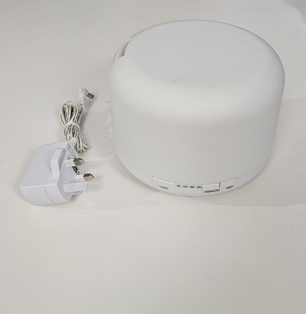 Essential Oil Diffuser (Category: Home Fragrance) located in Singapore. Submitted by lmproj (Listing ID 1430148355, Image 2). Description: - Dimensions: Diameter 17cm x Height 12cm. - Timer Setting: 1H/ 2H / 3H. - 500ML Aroma Diffuser with local SG 3 Pin Plug (Safety Mark Approved). - 8 LED changing light colours to choose. - Comes with mist function. It will auto-off when waterless to protect the machine from being damaged. - Can be used as a LE