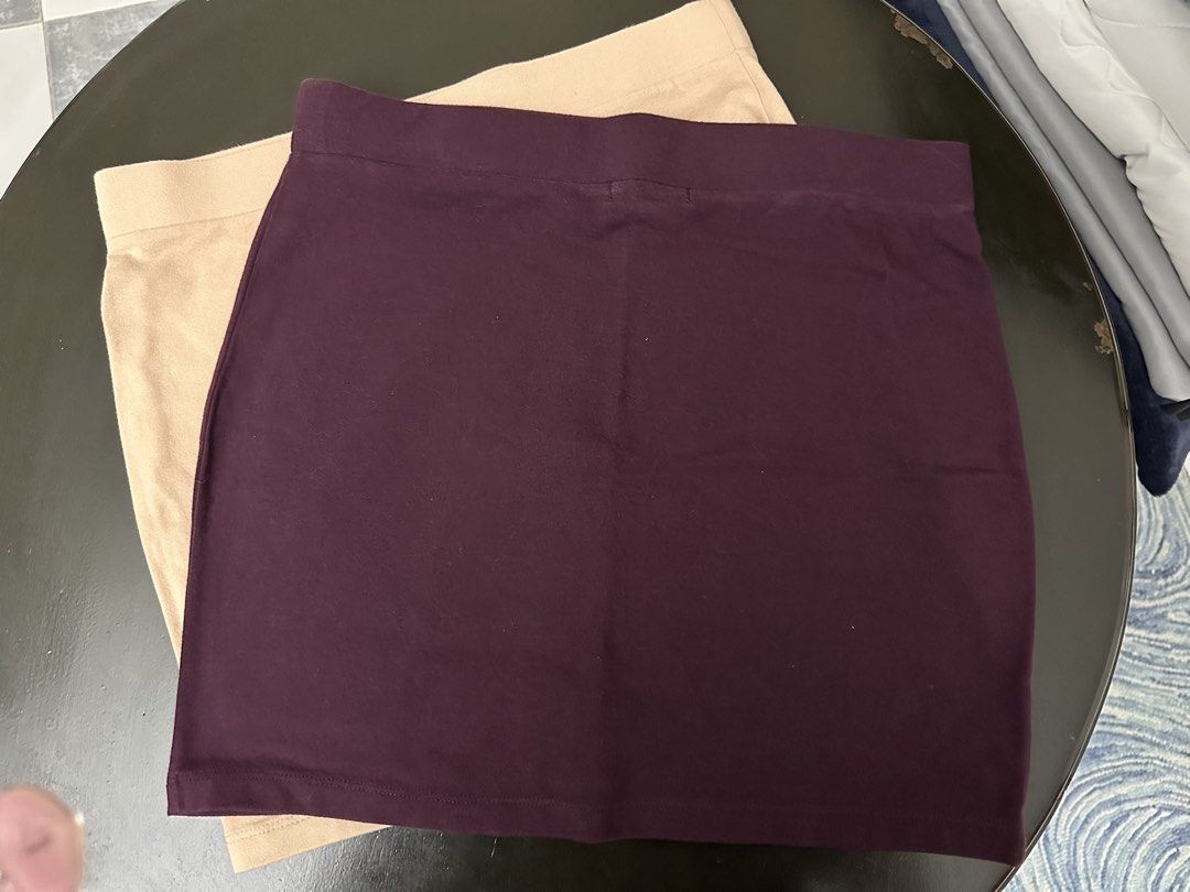 Forever 21 Mini Skirt (Category: Skirts) located in Muntinlupa City. Submitted by rantila (Listing ID 1430086520, Image 1). Description: Listing features a mini skirt from Forever 21. It is available in a dark purple and a beige color. The skirt is a size L. Made in Vietnam. The skirt has an elastic waistband..