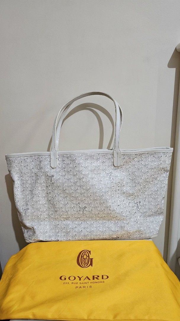 Goyard St. Louis Tote Bag White (Category: Luxury Bags & Wallets) located in Caloocan City. Submitted by marie_0812 (Listing ID 1430129331, Image 1). Description: Features a zip closure and a spacious interior. Includes a dust bag. The bag has the signature Goyardine pattern. Made in France. The bag has white leather handles and trim. The interior has a small pocket..