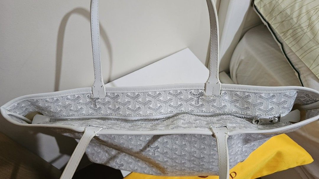 Goyard St. Louis Tote Bag White (Category: Luxury Bags & Wallets) located in Caloocan City. Submitted by marie_0812 (Listing ID 1430129331, Image 3). Description: Features a zip closure and a spacious interior. Includes a dust bag. The bag has the signature Goyardine pattern. Made in France. The bag has white leather handles and trim. The interior has a small pocket..