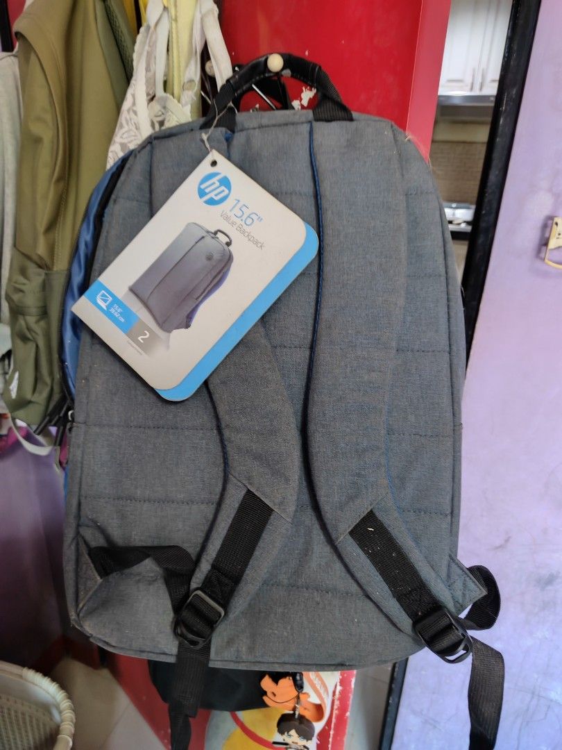 HP 15.6 inch Laptop Backpack (Category: Backpacks) located in Caloocan City. Submitted by MovesLikeJeager (Listing ID 1430067097, Image 3). Description: HP backpack is designed for 15.6-inch laptops. It features a gray exterior with the HP logo. The backpack has a main compartment and a front pocket. The dimensions are 310mm x 100mm x 445mm (12.2in x 3.94in x 17.52in), and it weighs 0.465kg (1.02lb)..